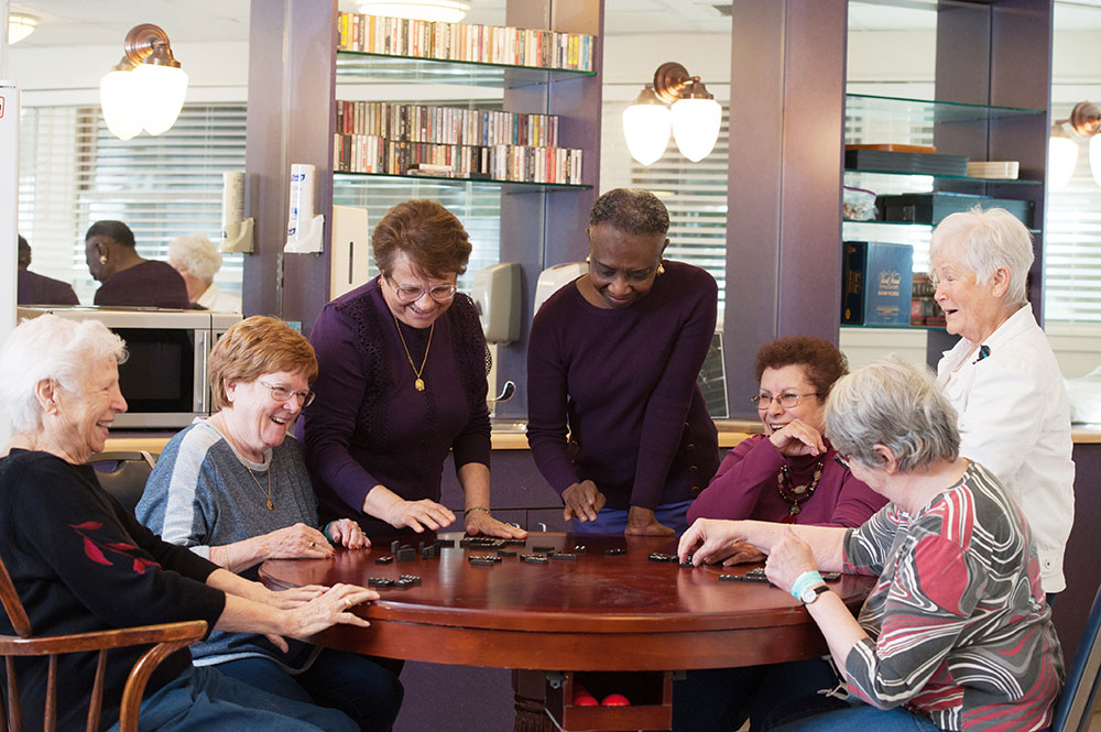 group of women playing dominoes